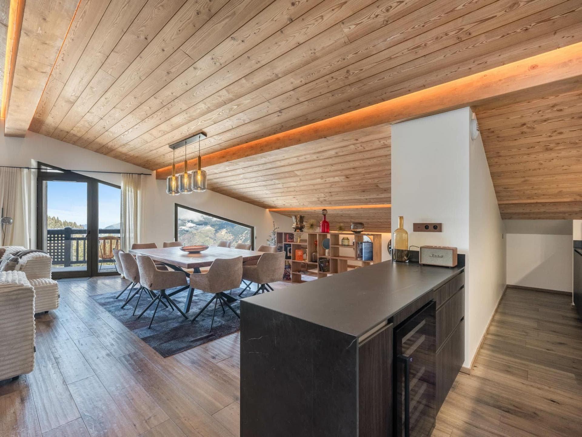 Open-plan dining area with seating for 8 and built-in wine cooler