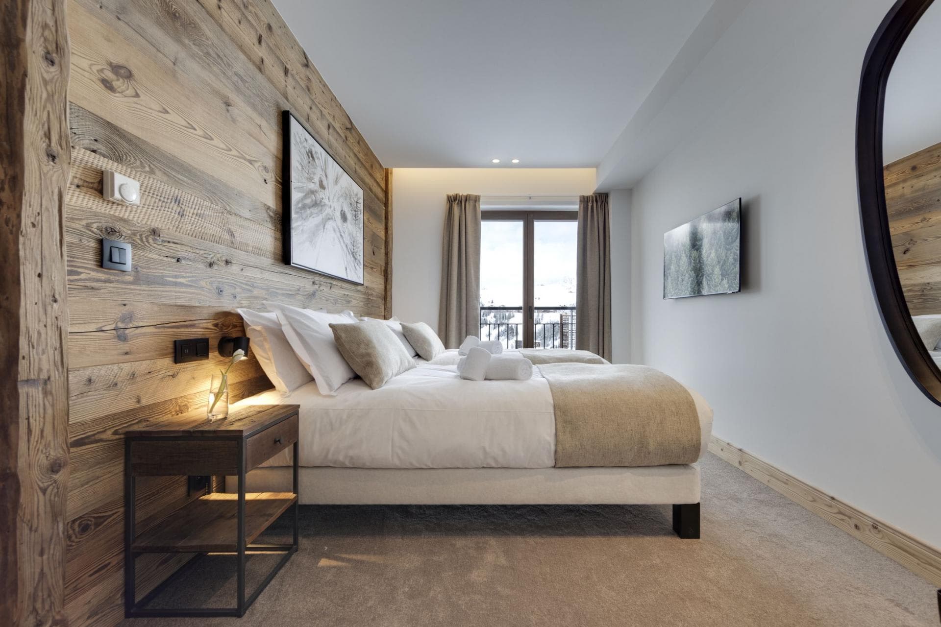 Guest bedroom with twin beds and private balcony access