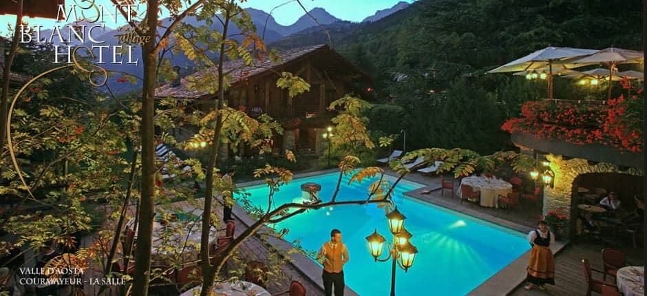 Outdoor pool with mountain views and poolside dining terrace