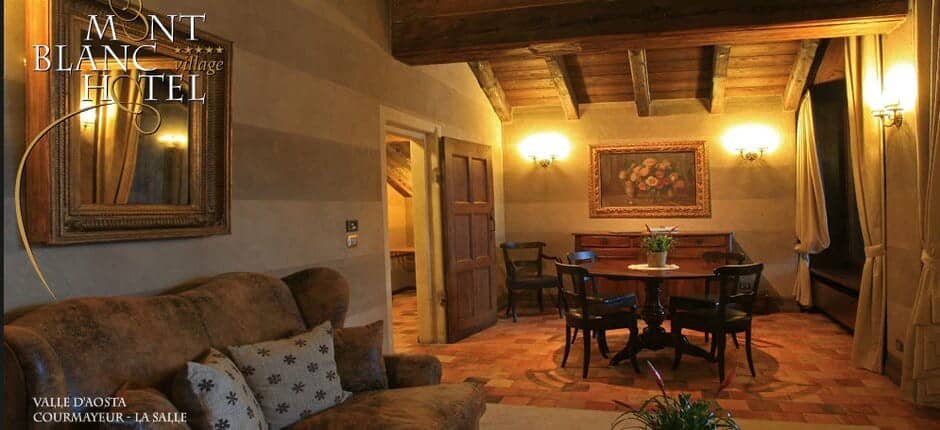 Living area with dining table for four and exposed wood beams