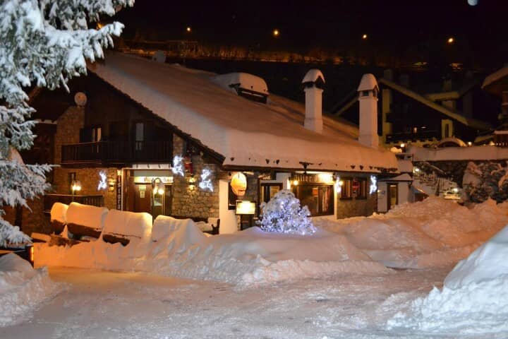 Snow-covered chalet exterior; walking distance to village restaurants