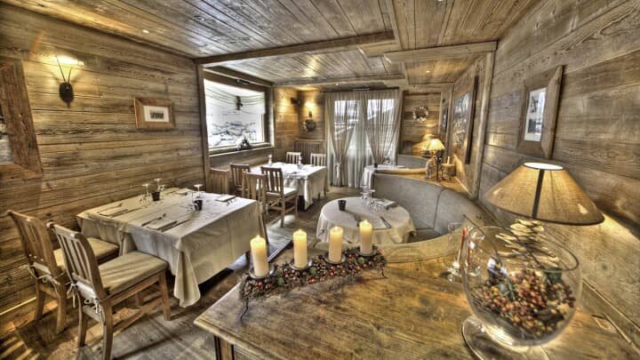 Dining area with reclaimed wood walls and seating for 12