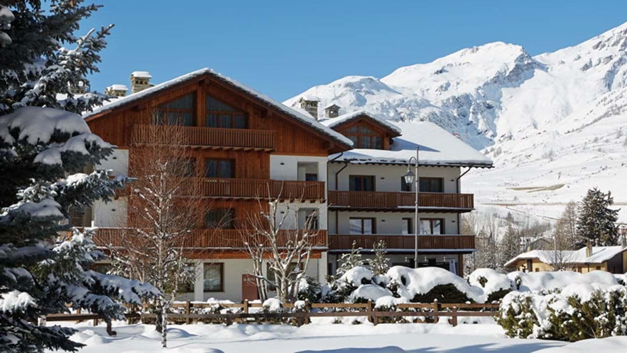 Chalet exterior with private balconies and mountain views