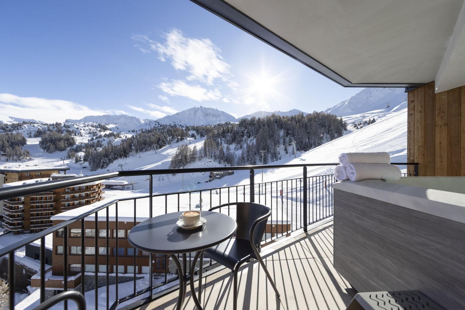 Private balcony with hot tub and direct ski slope views