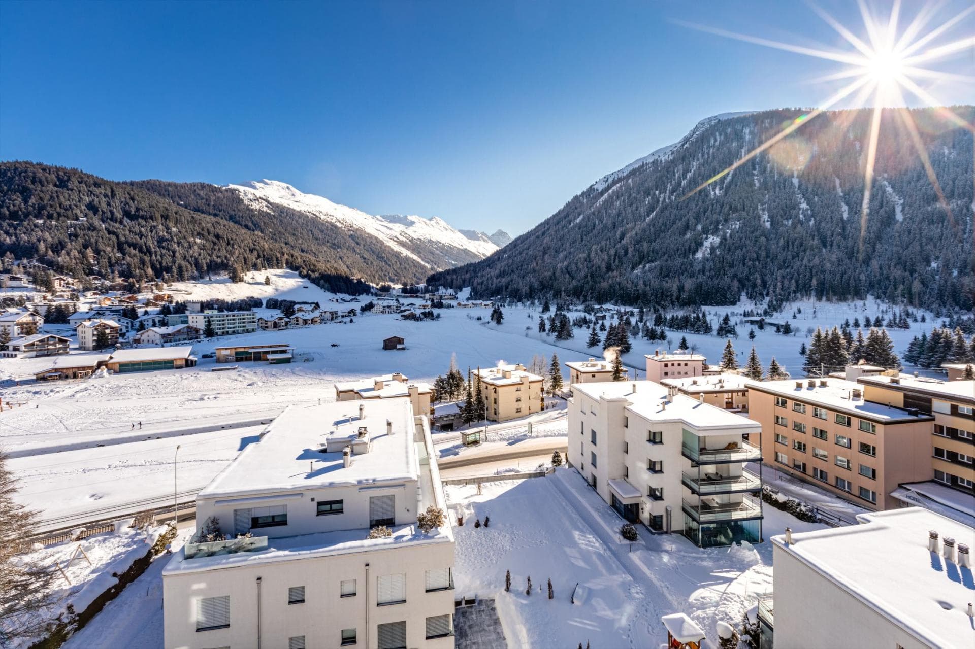 Elevated mountain and valley views over snowy alpine village