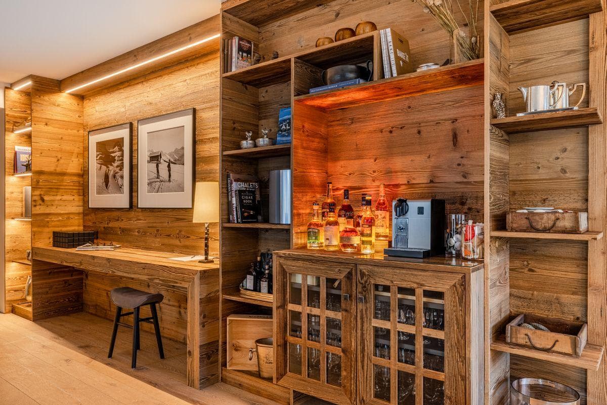 Integrated workspace and bar with Nespresso machine and glassware cabinet