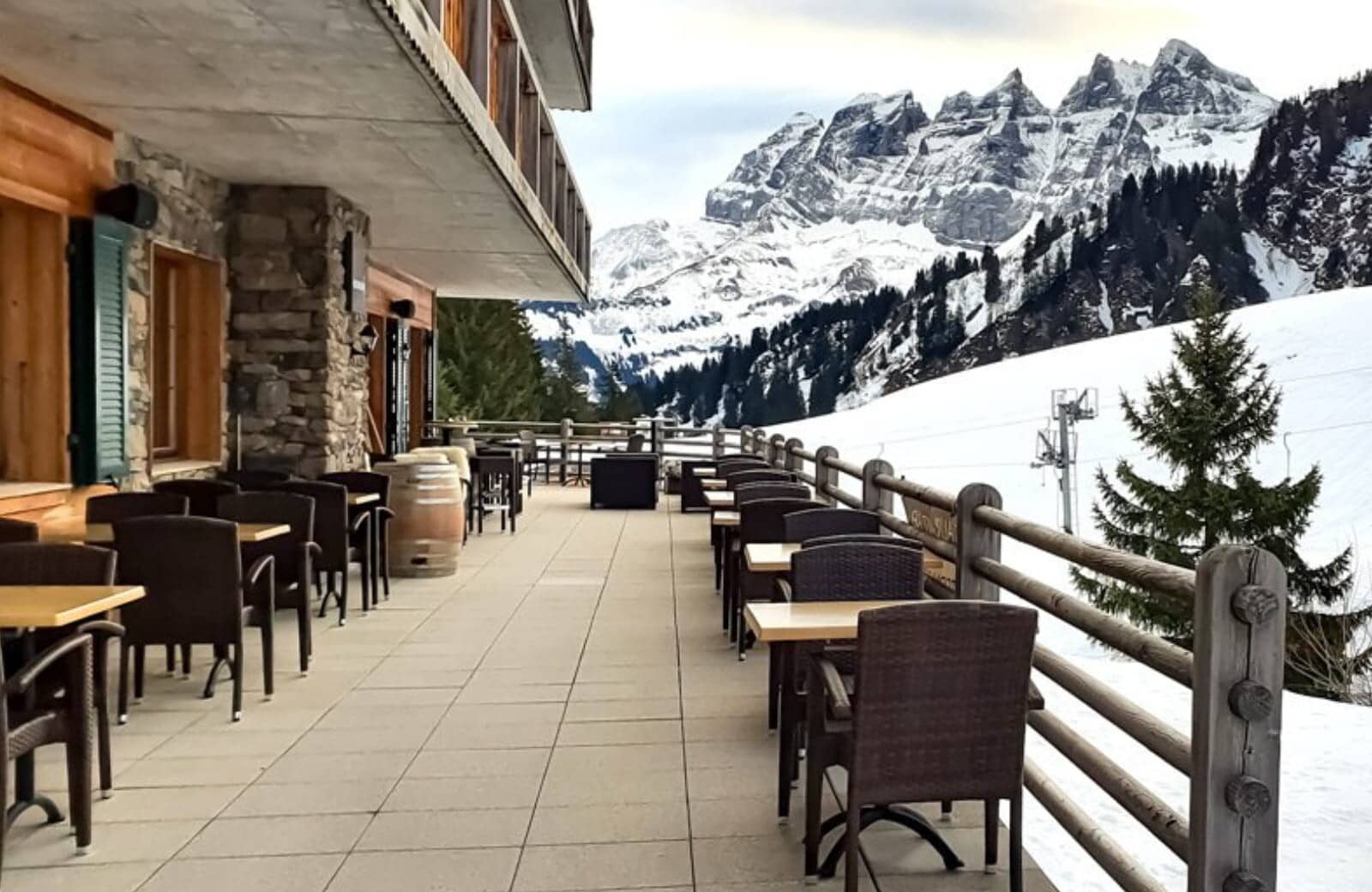 Ski-in/ski-out terrace with mountain views and outdoor table seating