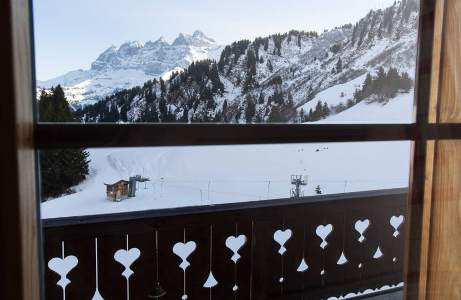Balcony view of ski lift and Dents du Midi mountain range
