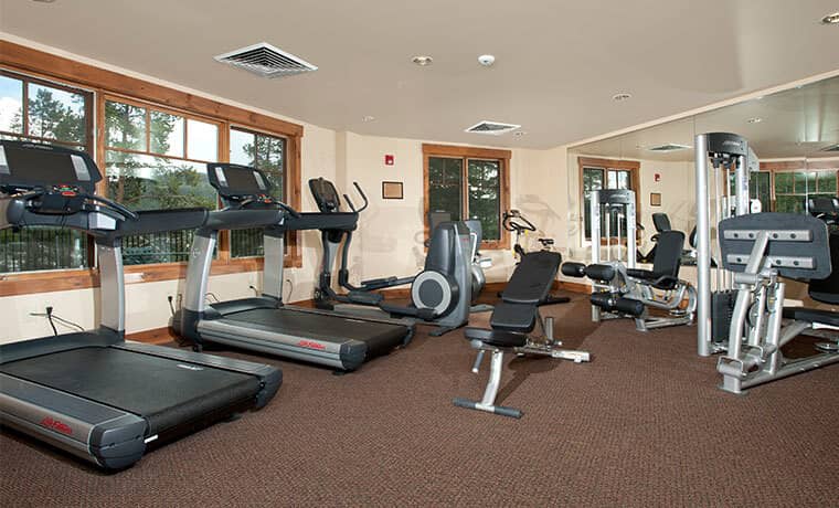 Fitness center with LifeFitness treadmills, elliptical, and weight machines