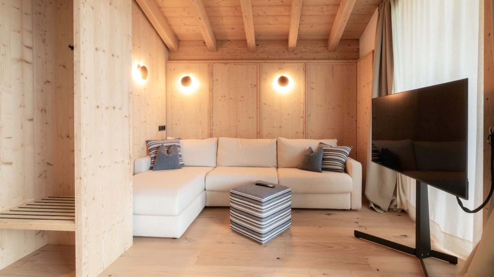 Media room with sectional sofa and swivel-mounted flatscreen TV