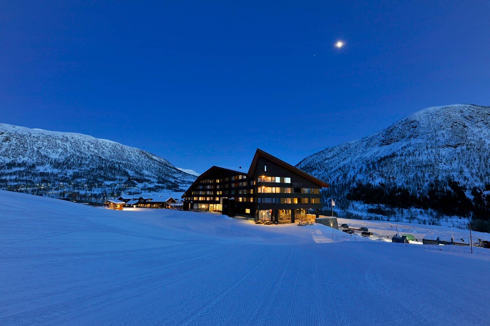 Ski-in/ski-out lodge exterior with direct access to groomed trails