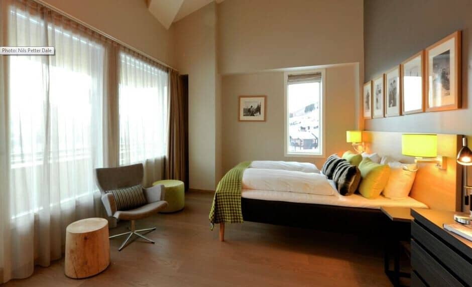 Primary bedroom with king bed and floor-to-ceiling windows