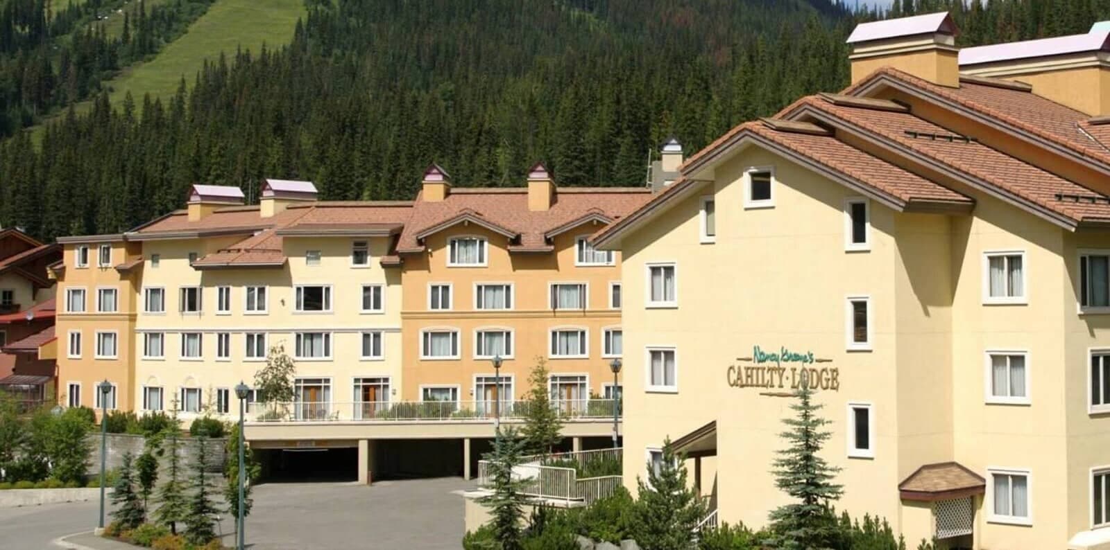 Cahilty Lodge exterior with ski slope access and covered parking