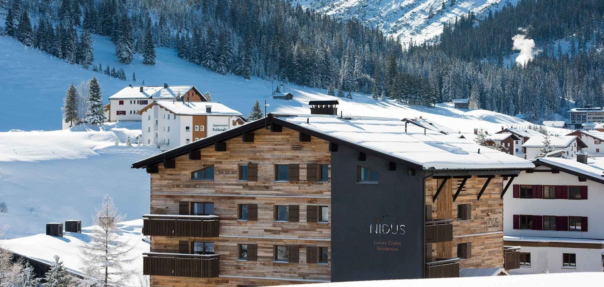 Chalet residence exterior with private balconies and mountain views