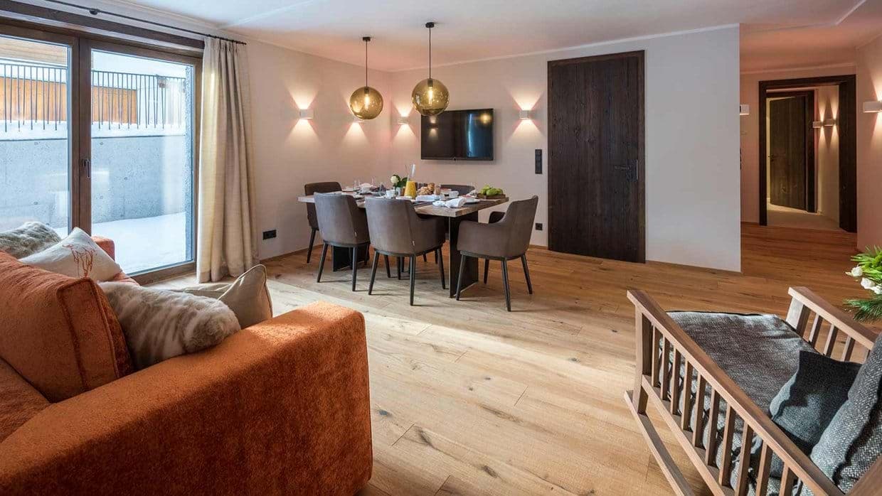 Open-plan living area with dining for 6 and terrace access