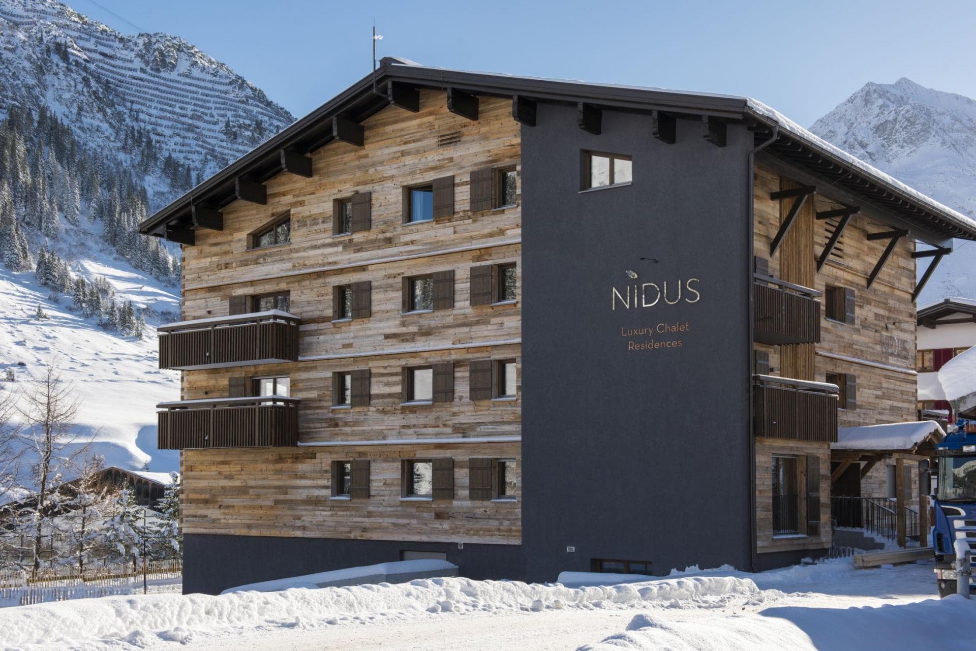 Nidus Chalet exterior with private balconies and mountain views