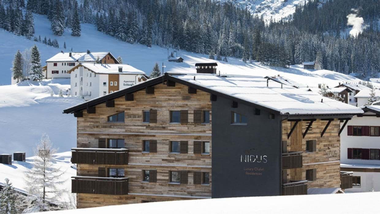 Chalet residence exterior with private balconies and mountain views