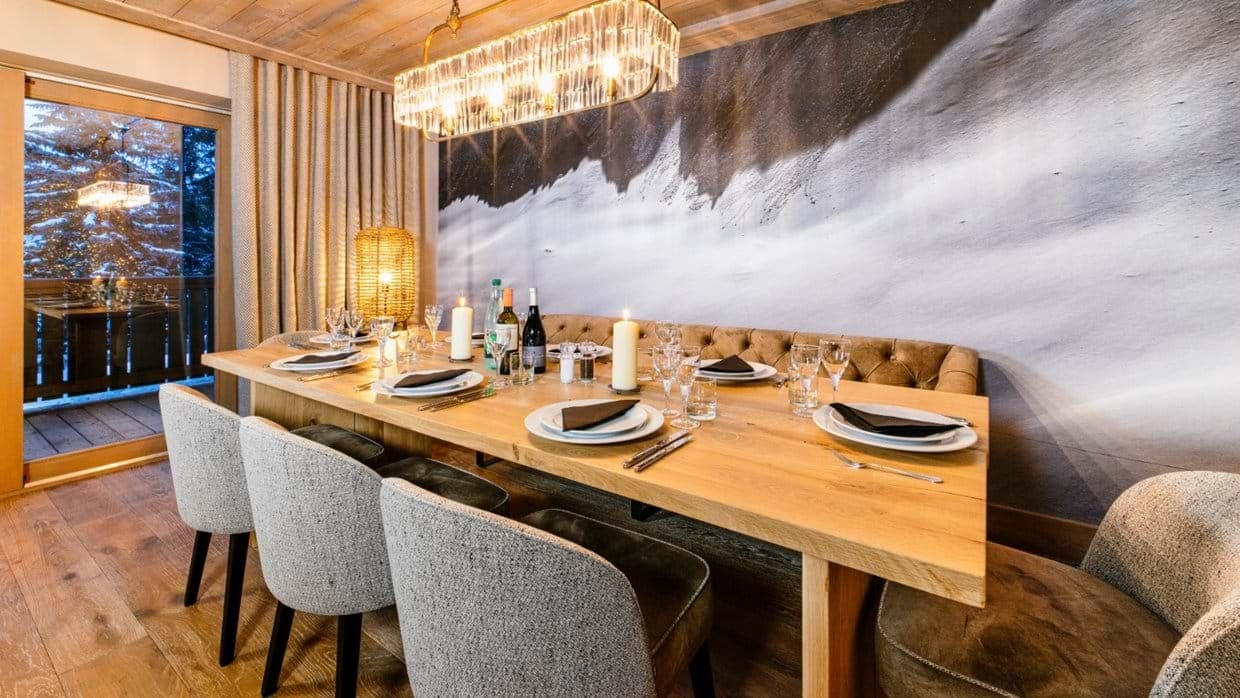 Dining area with banquet seating for 10 and terrace access