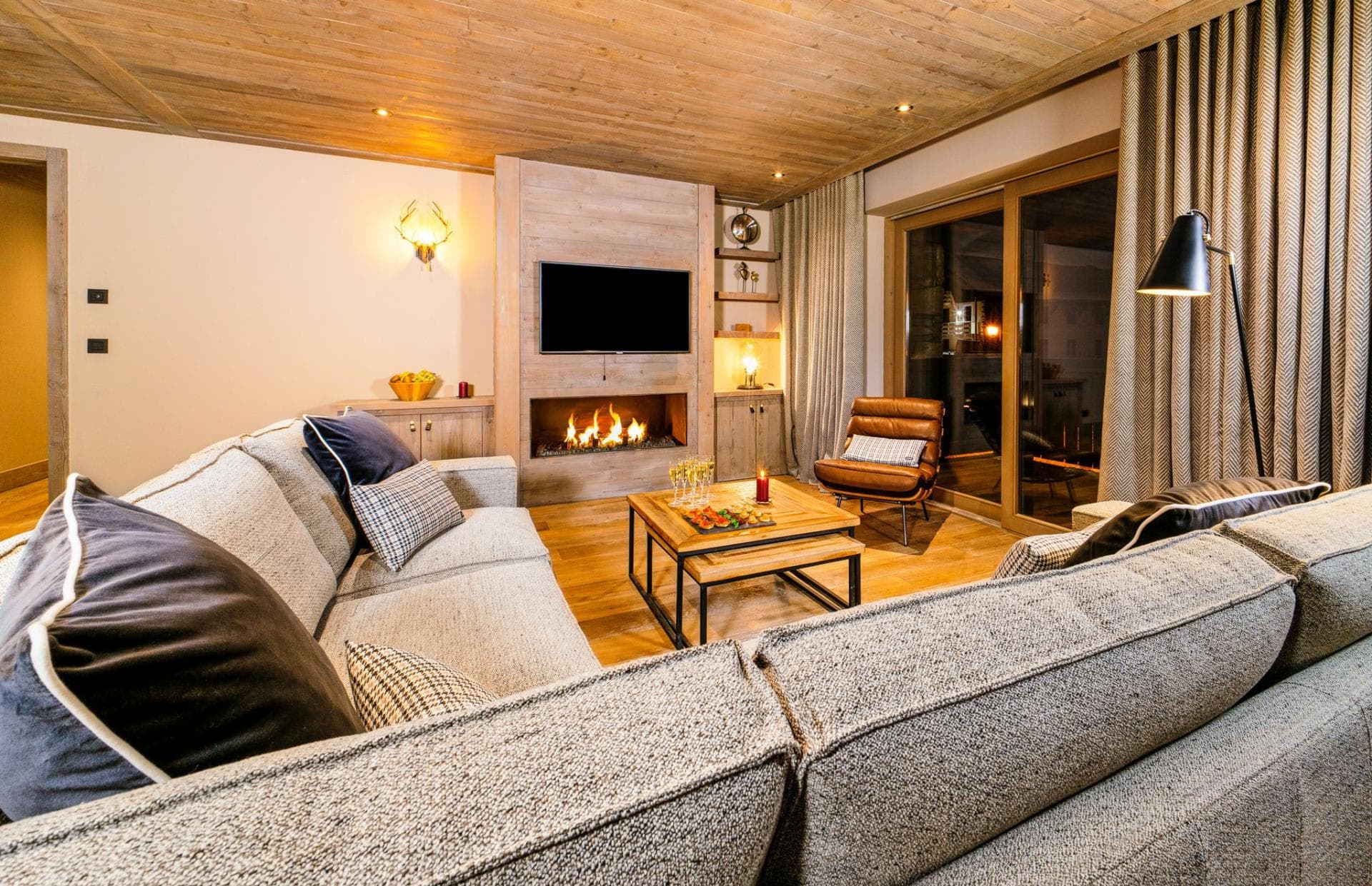 Living area with gas fireplace and sliding doors to balcony