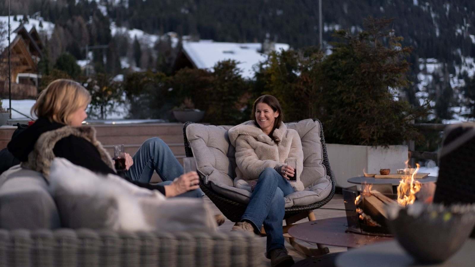 Outdoor terrace with wood-burning fire pit and alpine valley views