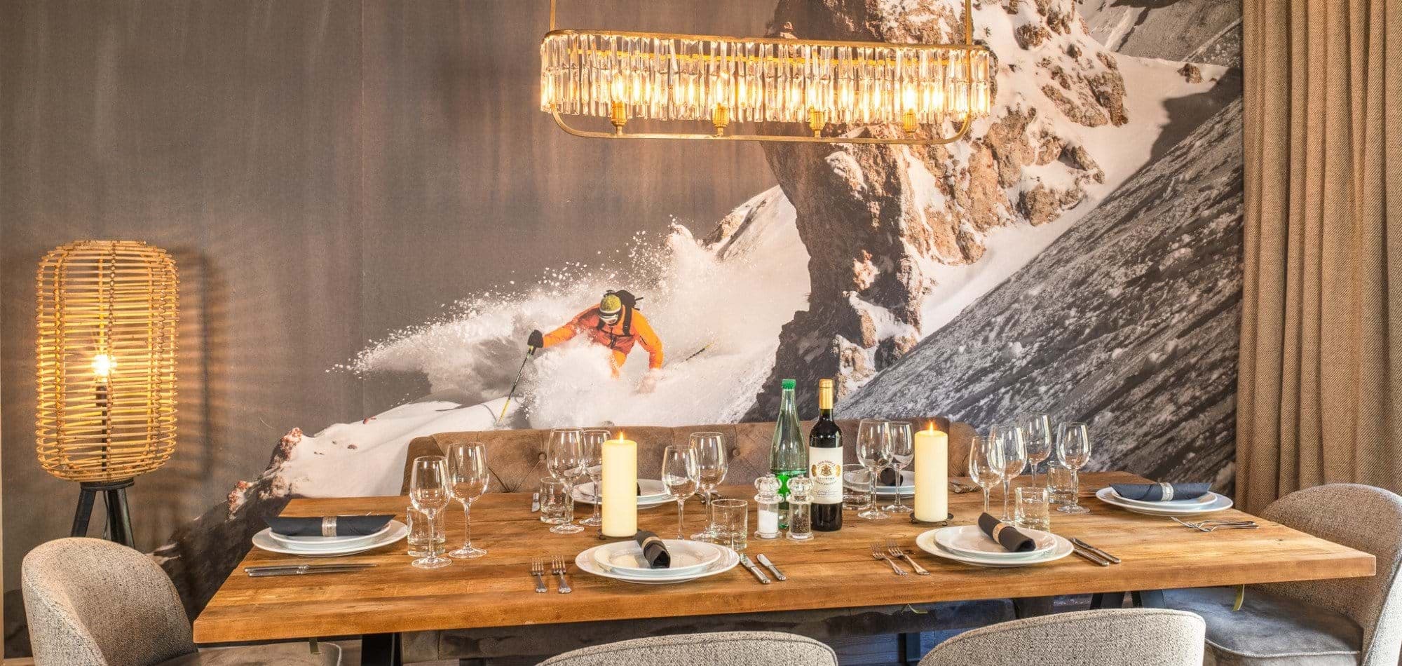 Dining area with mountain mural and banquet seating for six