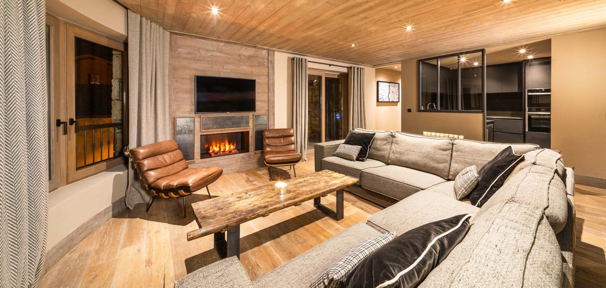 Living area with electric fireplace and sectional seating for 8