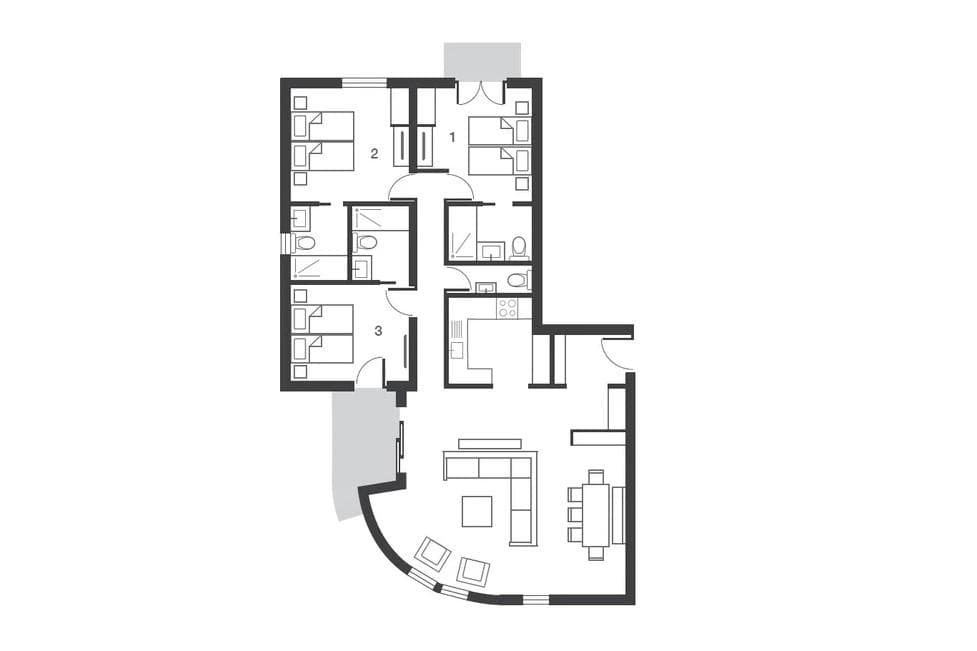 Floor plan: three bedrooms, two bathrooms, and open-plan living with curved balcony