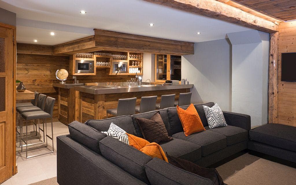 Lower level lounge with wet bar, beer tap, and sectional seating