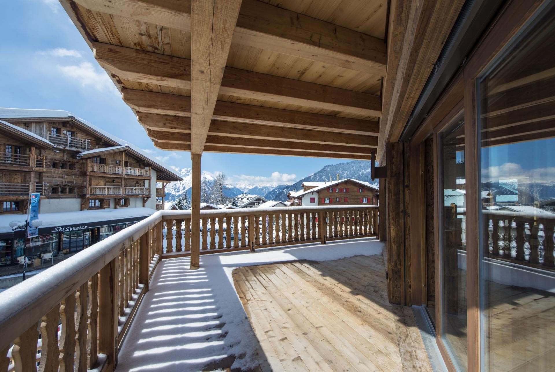 Covered balcony with mountain views and proximity to ski services