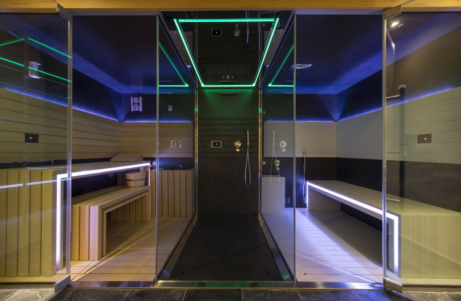 Wellness suite with private sauna and rainfall shower with chromotherapy lighting