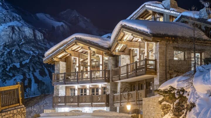 Three-story stone and timber chalet with private balconies