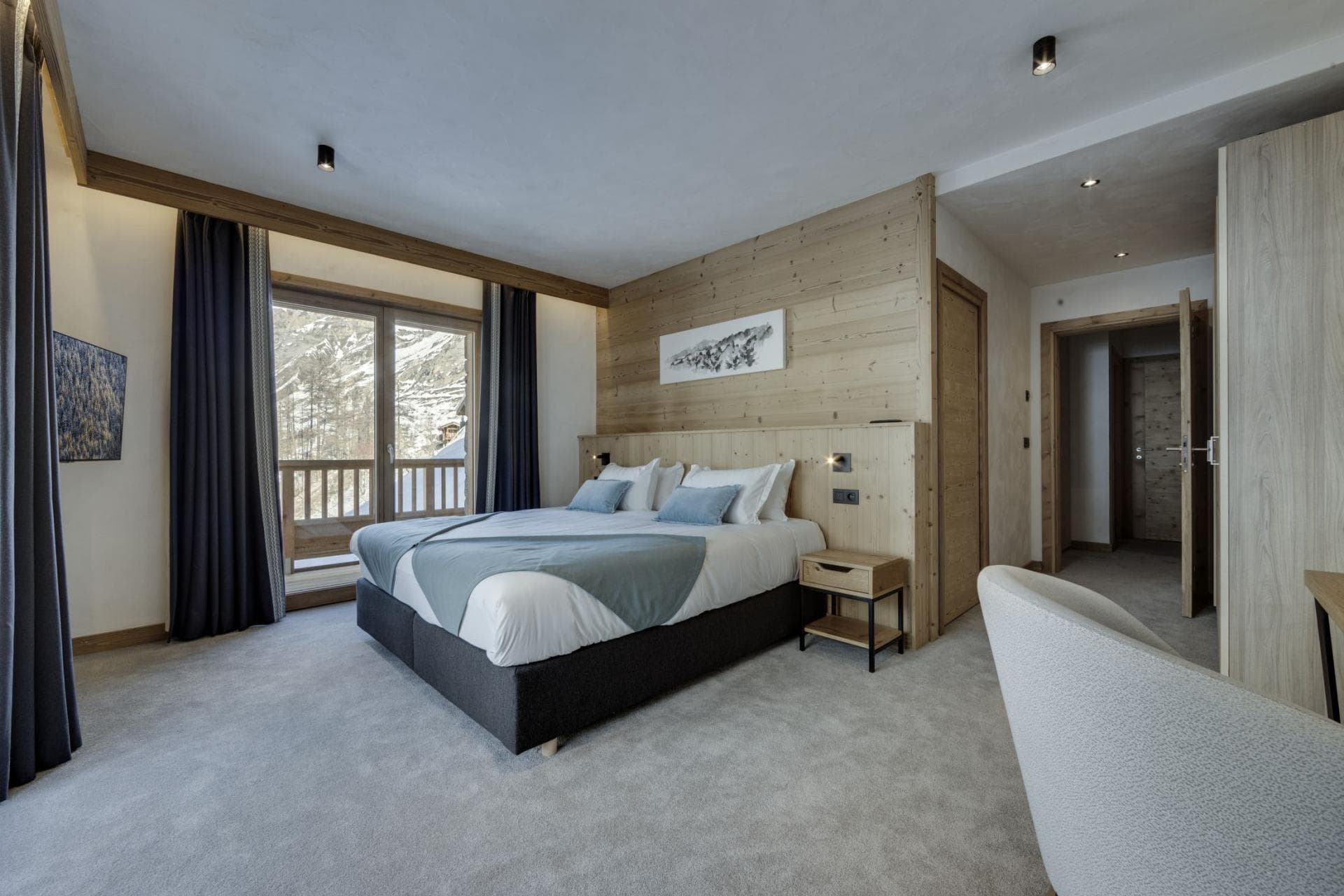 Primary bedroom with king bed and private balcony access