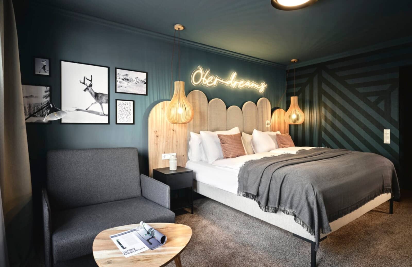 Guest bedroom with king bed and additional armchair seating area