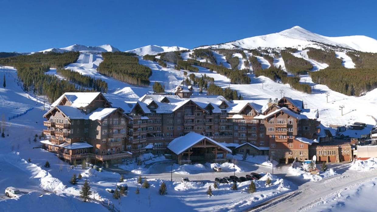 Ski-in/ski-out lodge exterior with direct access to mountain runs