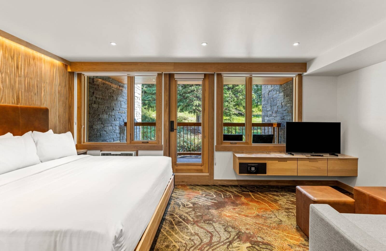 Primary bedroom with king bed and private balcony access