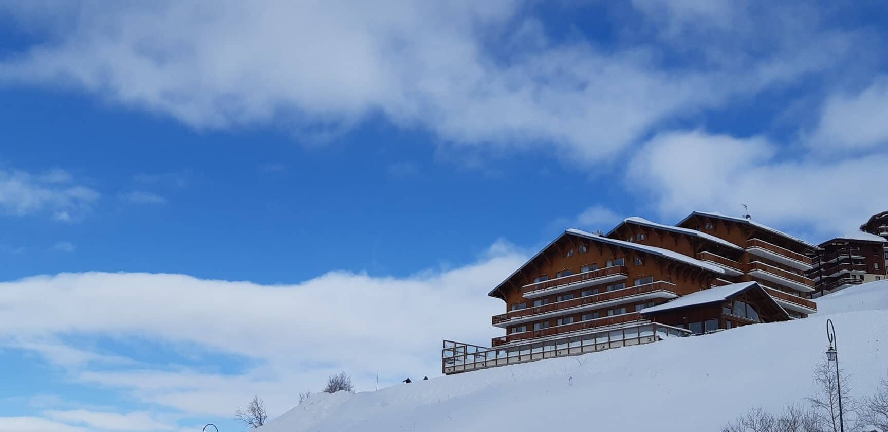 Ski-in/ski-out chalet exterior with private balconies and mountain views