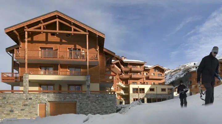 Ski-in/ski-out chalet exterior with private balconies and mountain access