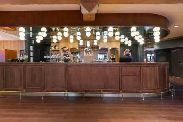 Hotel bar and reception desk with local craft beer on tap