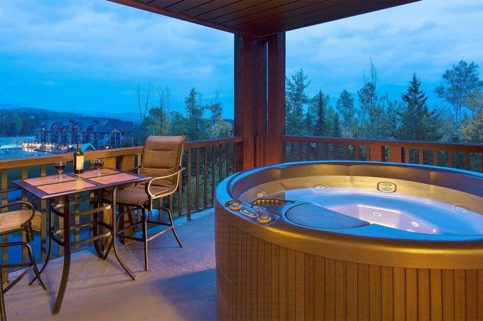 Covered balcony with private hot tub and bistro seating for two