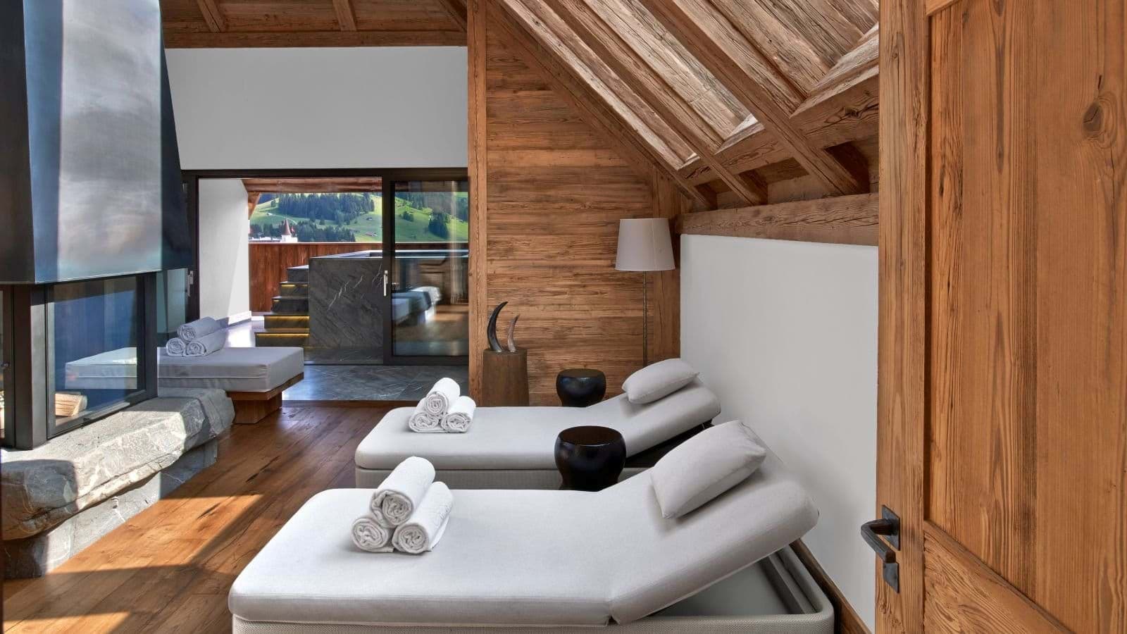 Private spa room with wood-burning fireplace and terrace access