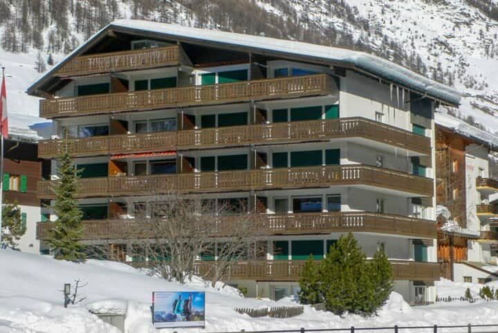 Ski-in/ski-out apartment building with private balconies and mountain views