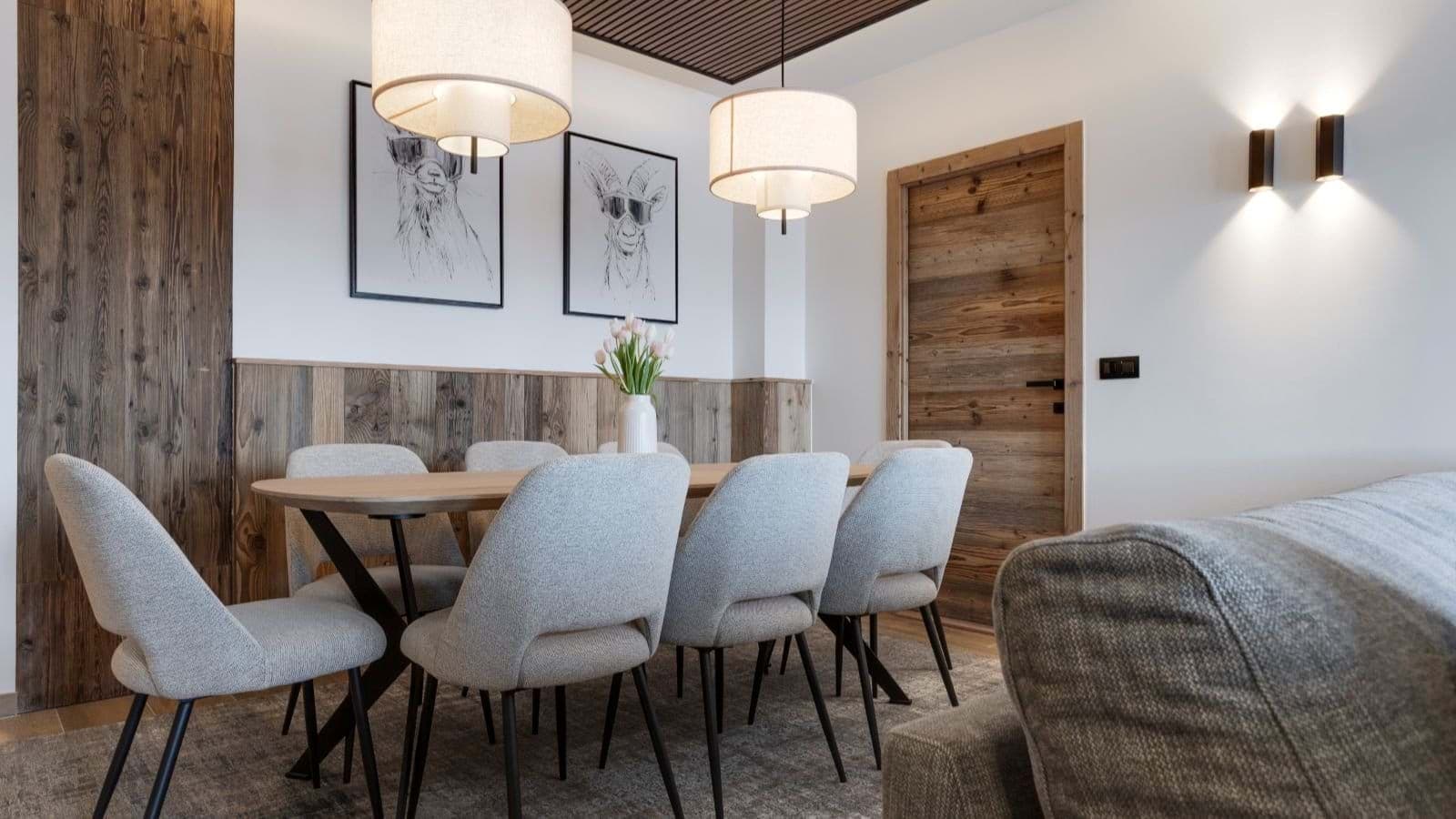Dining area with seating for 8 and reclaimed wood wall paneling