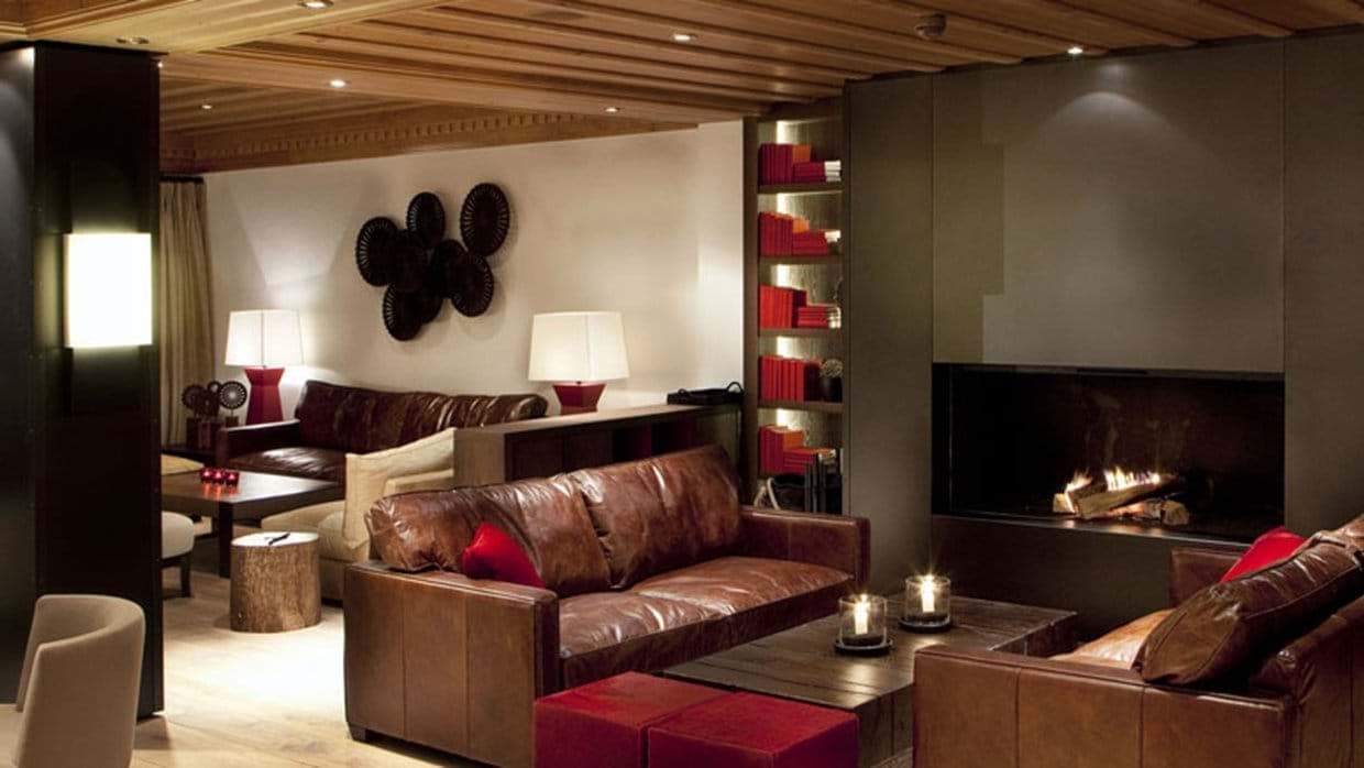 Living area with wood-burning fireplace and leather seating for 8