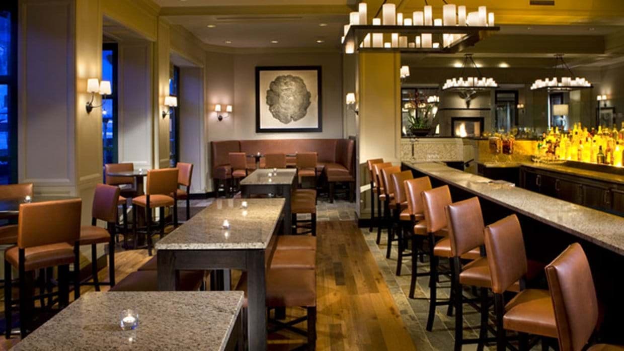 Hotel bar and lounge with granite counters and leather seating