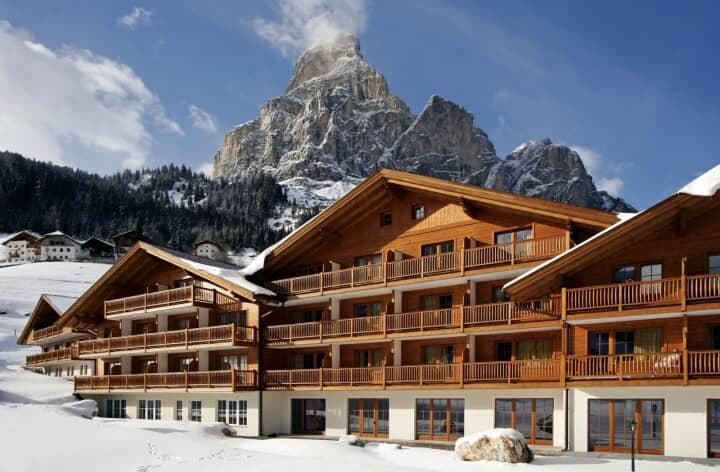 Chalet-style exterior with private balconies and mountain views