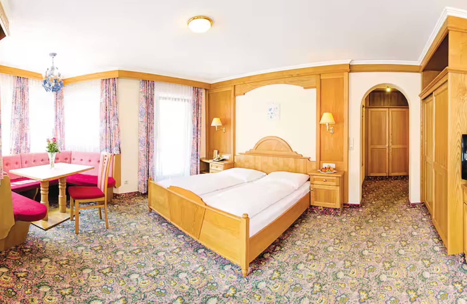 Primary bedroom with king bed and built-in breakfast nook