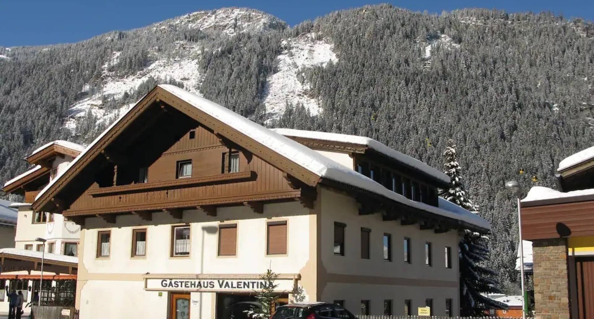 Chalet exterior with mountain views and private parking