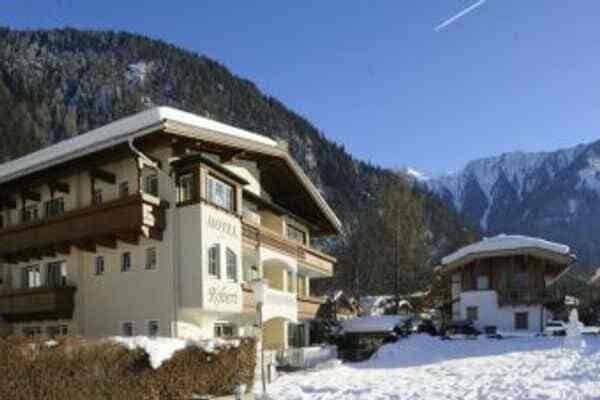 Chalet exterior with private balconies and mountain views
