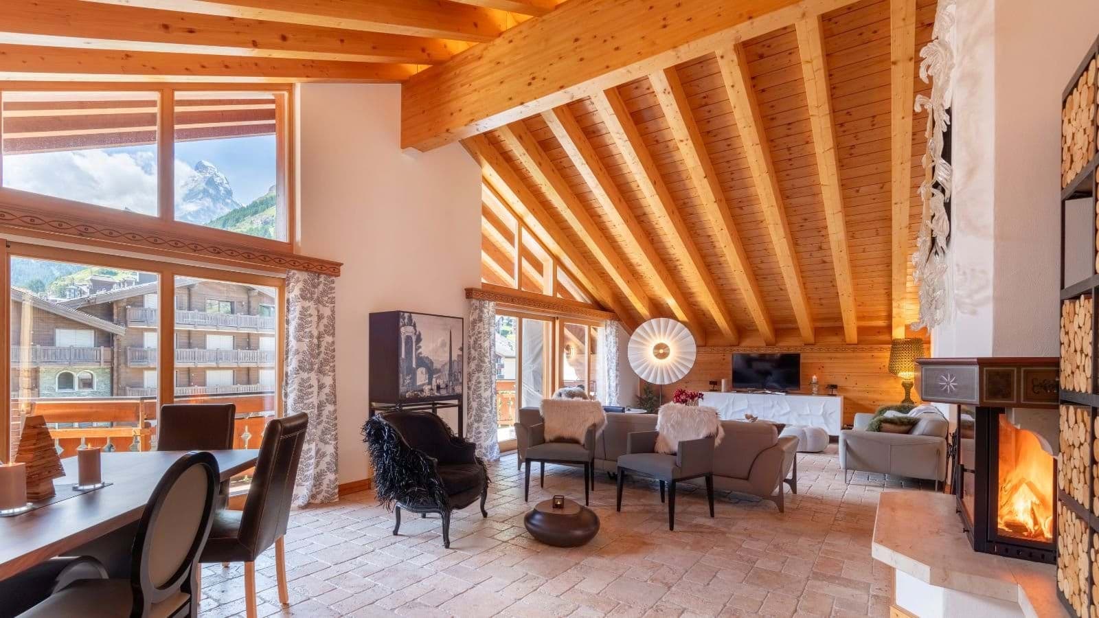 Open living area with wood fireplace and Matterhorn views