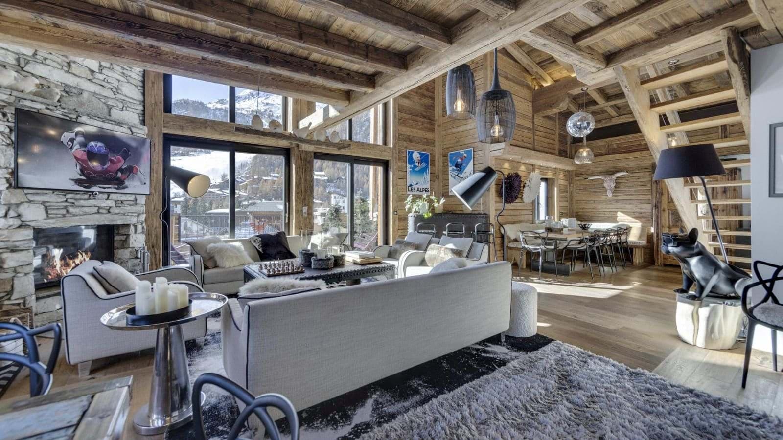 Open living area with wood-burning fireplace and mountain-view balcony